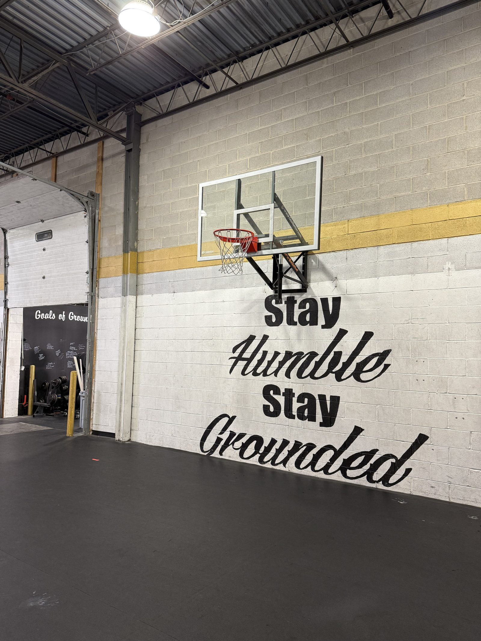 The Stay Humble, Stay Grounded mural inside the gym